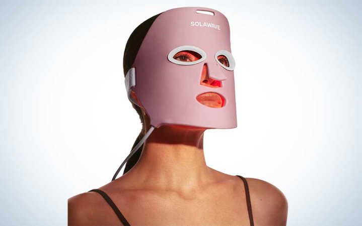  A woman wearing a SolaWave red light therapy mask